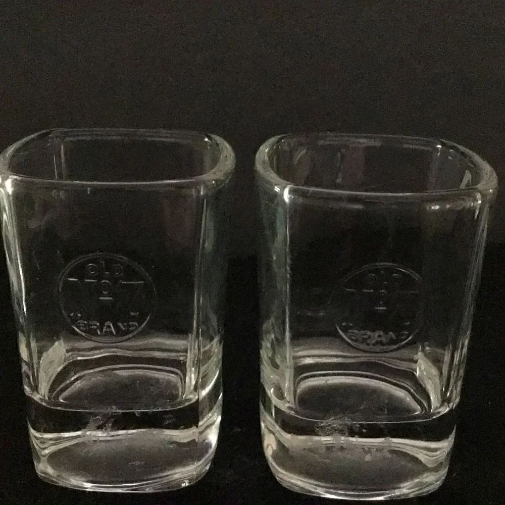 Shot glasses set up to Jack Daniels old number seven shot glass
